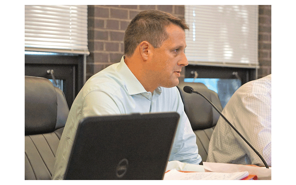 Bill Hannah, finance director for the Village of North Aurora, presents information about North Aurora’s electric aggregation program at the North Aurora Village Board meeting Monday.