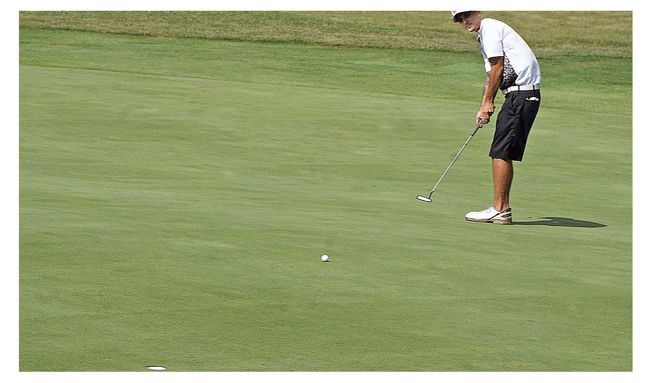 Cameron Parker views his 30-foot putt halfway to the cup in the 18th green and final hole of the 87th annual Aurora city golf tournament Sunday at Phillips Park in Aurora. Parker sank the putt and won the 36-hole tournament by two strokes with 71-73-144. Carter Crane/The Voice