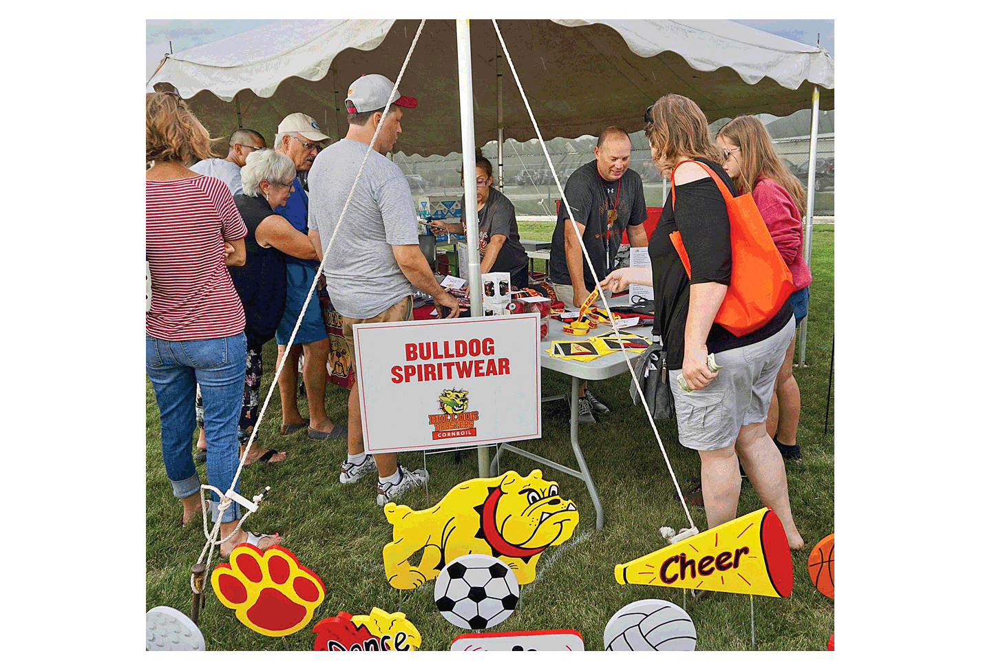 Bulldog spiritware is a focus at Friday’s annual Batavia Corn Boil outside of the stadium at Batavia High School. The evening included the introduction of the school’s Fall sports teams and marching band. The fundraiser, held by the Batavia Bulldog Athletic Boosters, included the sale of coupon books and yard signs. Approximately 1,200 ears of corn were cooked.