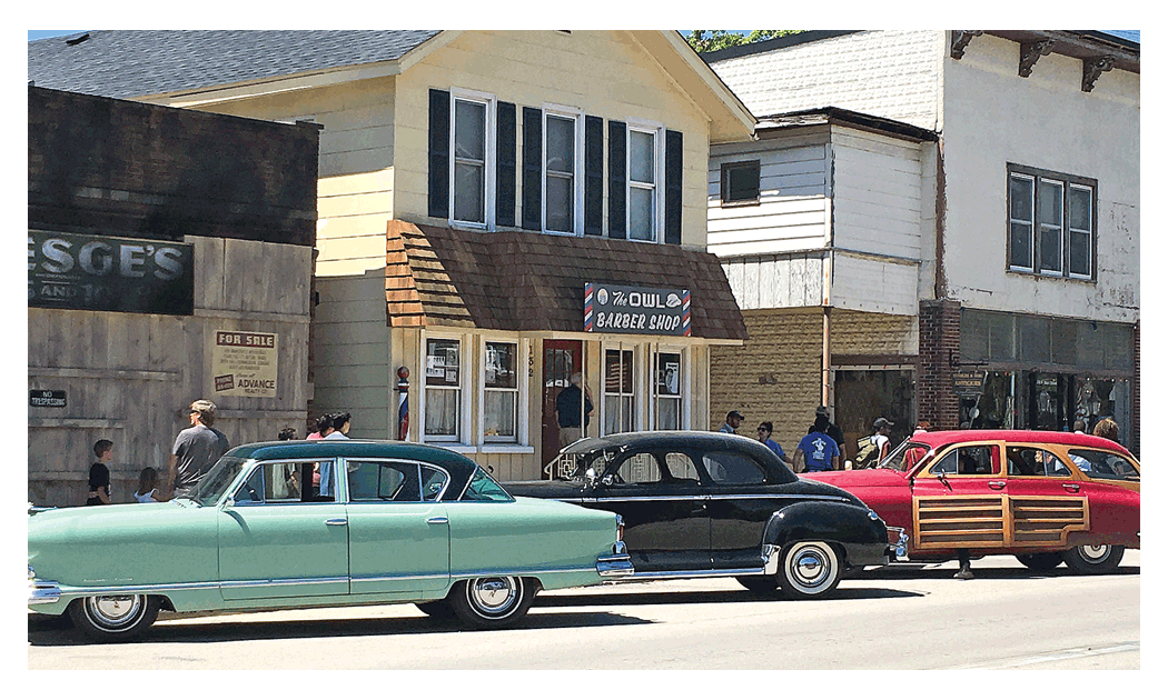 Elburn last week reflects a town in the middle 1950s for the production of HBO television drama horror series, Lovecraft Country. Note the change in the barber shop name for the series. Below, the crew sets up in an area along Main Street (Route 47).