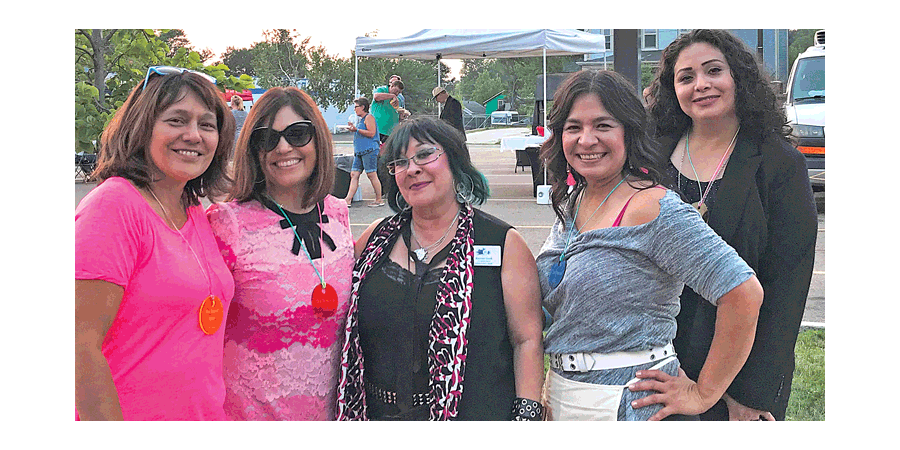 Aurora Public Library board members pose during a barbecue.