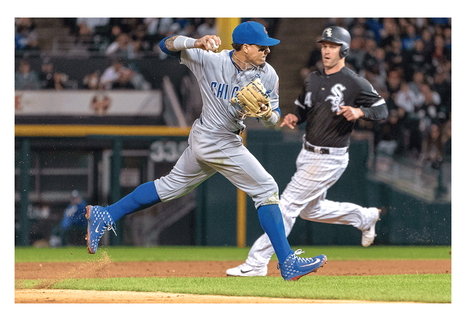 Chicago Cubs shortstop Javier Baez prepares to throw to first after fielding a ground ball against the host Chicago White Sox at Guaranteed Rate Field in Chicago Saturday. The Cubs won the game, 8-3, won two of three games in the series, and Baez hit his 34th home run this season. Sean King for The Voice