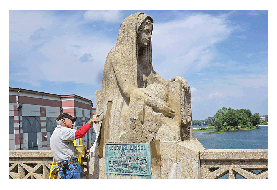 Jim Jenkins restores and repairs the sculpture on the New York Street Memorial Bridge in Aurora named Memory