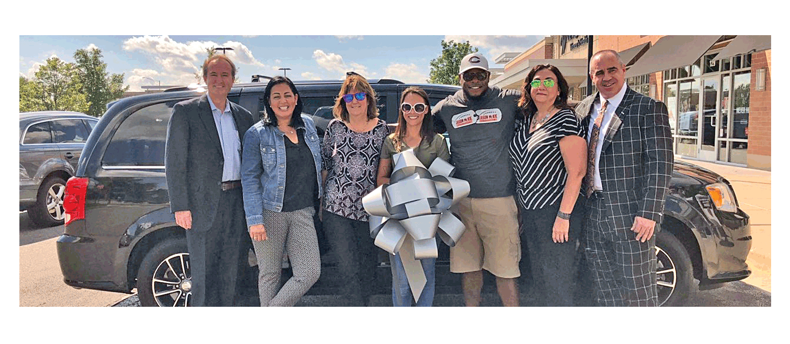 Marine veteran Alyssa Michelle receives help with a vehicle for her family, including her four kids. Those who helped include, from left, Mike Lee, president of the Kane County Teacher's Credit Union; Linda Chapa LaVia, State representative; Sherry Tatar, Alyssa's aunt; Alyssa Michelle Tatar; Jason McKie, Jason McKie Foundation, former Chicago Bears player; Michelle Novak-Cianferri; and Glen Muller, owner of Muller Acura of Merrillville, Ind.. Jessica Gonzales photo