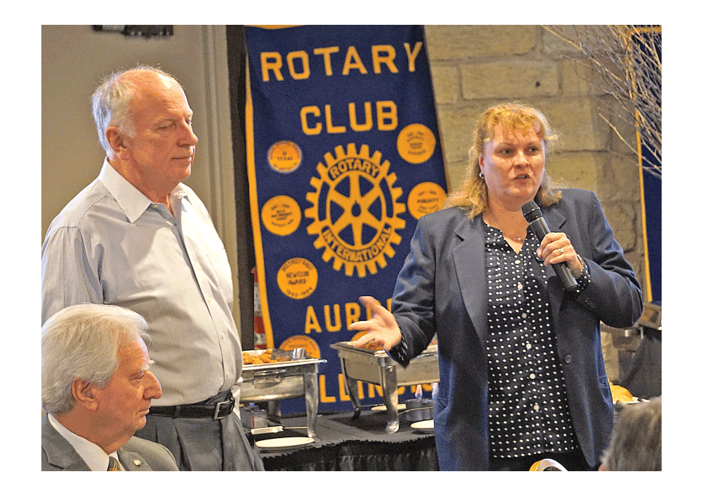 Ron Janusz, president, and Melinda Kruder, vice president of Support Companies, LLC, present information at the Rotary Club of Aurora meeting Monday at Two Brothers Roundhouse in Aurora. They shared an update about the former Aurora Public Library building at 1 E. Benton Street in downtown Aurora which is home to Support Companies 24/7 contact center, training and product labs, IT and server operations, and administrative offices. The building was vacant for six months in 2015 with its fate in question, including possible demolition of the 42,000 square-foot Carnegie library. A Carnegie library is a library built with money donated by businessman and philanthropist Andrew Carnegie. A total of 2,509 Carnegie libraries were built between 1883 and 1929 in several countries. The 1 E. Benton location was a stop on the recent Illinois Solar Tour after solar photovoltaic panels were recently installed on the rooftop. The terms of the building purchase agreement included a price of $10 with $50,000 per year donations to the Aurora Public Library Foundation for a minimum of five years. The building was placed on public tax rolls for the first time, to benefit local taxing bodies, including the city of Aurora and East Aurora School District 131. Jason Crane/The Voice