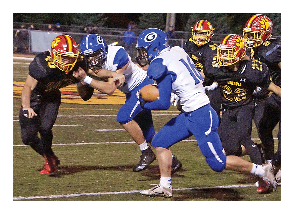 Jack Kane of Geneva High School, 16, breaks open momentarily against Batavia’s defense Friday in the teams’ 100th game in the series. Host Batavia prevailed, 41-0, in its first shutout of the season. Geneva leads in the series, 51-44-5. Batavia improved to 6-0 overall and 4-0 in the DuKane Conference and Geneva was dropped to 0-6 and 0-4. Carter Crane/The Voice