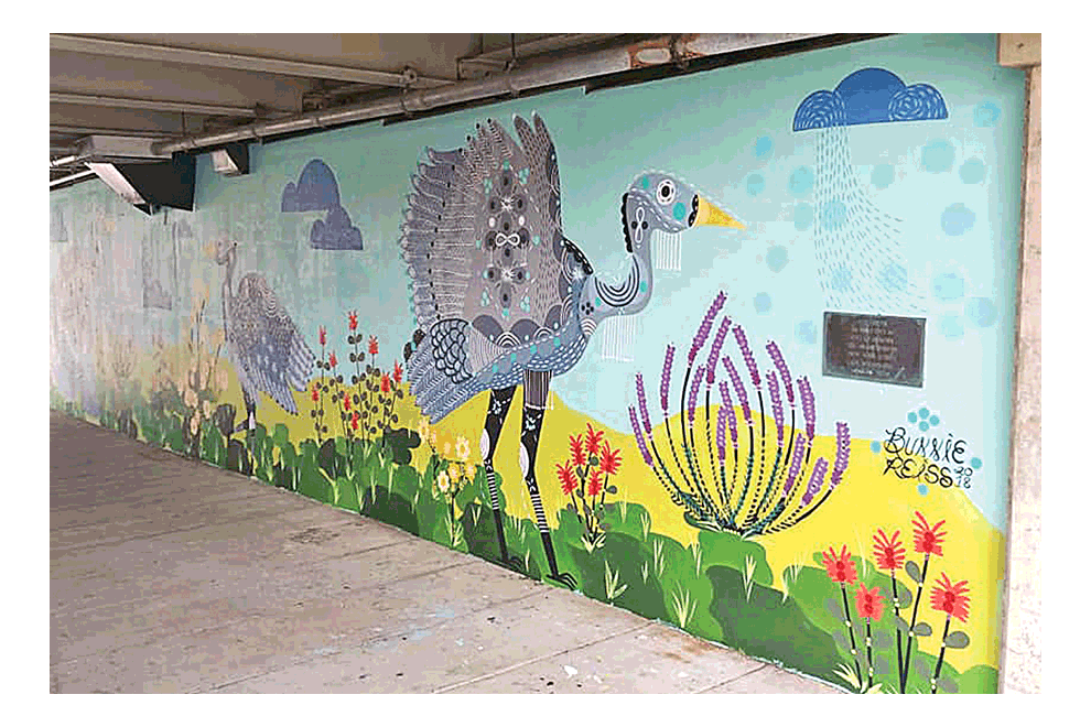 Painting of murals in Aurora continues to flourish. The Bunnie Reiss mural, recently completed, is on the wall behind Endiro Coffee along the Fox River bike and walking path. Charlie Zine photo