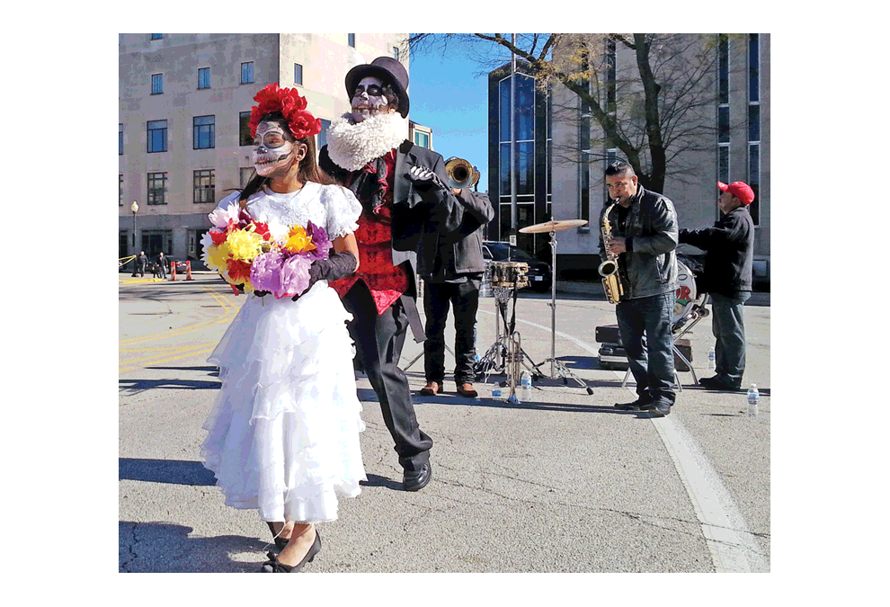 Jose Torres, in top hat, celebrates Day of the Dead on Benton Street in 2015. This year, the festival is back outdoors, weather permitting, during First Fridays November 2. Marissa Amoni photo
