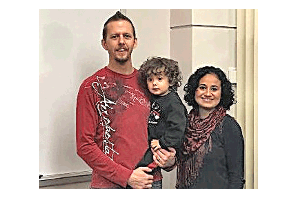Paloa Having, right, with husband, Eric, and son, Josiah, pose for a photo at the Aurora Public Library Eola Branch. Submitted photo