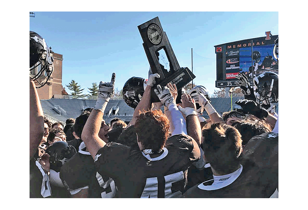 The Hilltoppers celebrate a State championship in Class 5A football Saturday following a 35-27 victory over Montini at the University of Illinois in Champaign/Urbana. JCA won its 14th football State championship. Joliet Catholic Academy photo