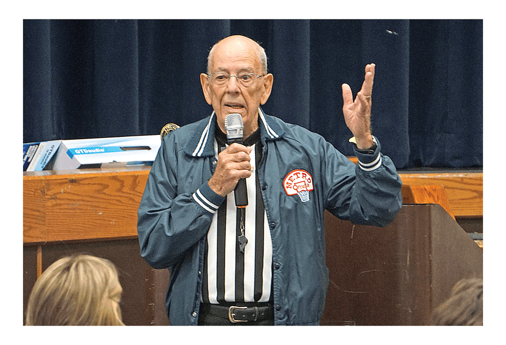 Official at Kiwanis: Ernie Poochigian reflects on his more than 40 years as a sports field and floor official at the Kiwanis Club of Aurora luncheon Tuesday at the Prisco Center in Aurora. Poochigian was behind the whistle from 1970 to 2013. He officiated middle school, high school, and college basketball games throughout northern Illinois for 41 years and football for 31 years. He recalled one of the most exciting and intense football games ever in the early 1990s between high school rivals Oswego and Morris. He recalled a women’s college basketball game in which the other scheduled referee couldn’t make it and he had to call the game by himself. He said the coaches called extra time outs so he could catch his breath. Jason Crane/The Voice