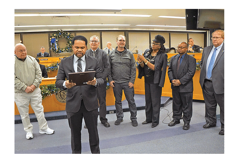 Mayor Richard C. Irvin of Aurora reads a proclamation to honor the 40-year anniversary of Covenant Christian School in Aurora. Jason Crane/The Voice