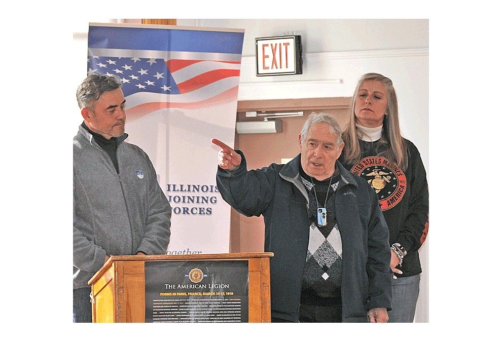 Richard Williams, Plainfield, a World War II veteran, talks to a group of veterans Sunday at the first Open Mic Veterans Town Hall in the Midwest at the David L. Pierce Art and History Center in Aurora. The event followed the Veterans Day parade in Aurora. Left is Jaime Martinez, executive director of Illinois Joining Forces, a host group. Right is former Marine Stephanie Kifowit. Jason Crane/The Voice