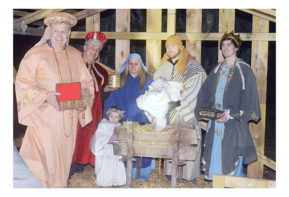 Cast members pose for photos following the Faith Lutheran Church performance of “The Christmas Story.” The church in Aurora fourth annual outdoor live nativity presentation was Saturday. The event featured 25 congregants in period costumes, a petting zoo, and fair-trade market. Al Benson/The Voice