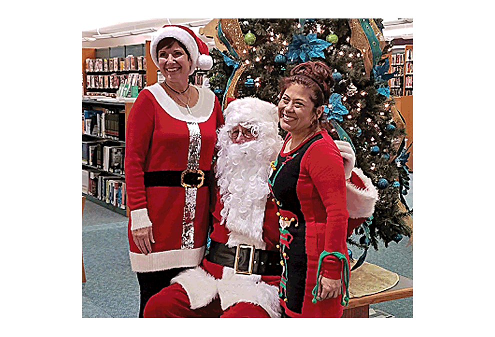Santa and two elves, who pose for photos, are expected to be in attendance Sunday, Dec. 9 at the Aurora Public Library West Branch open house. Submitted photo