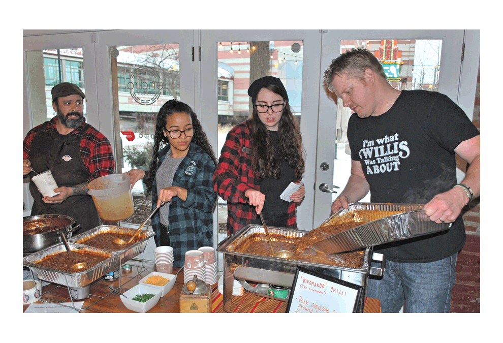 Cody Lorance of Endiro pours in more chili Saturday at Endiro in the Chili Bowl, sponsored by ELEMY. Seven restaurants competed. Endiro finished in first. Jason Crane/The Voice