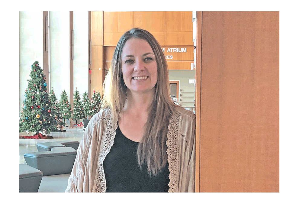Krista Danis stands in the Durham Atrium at the Santori Public Library of Aurora. Submitted photo