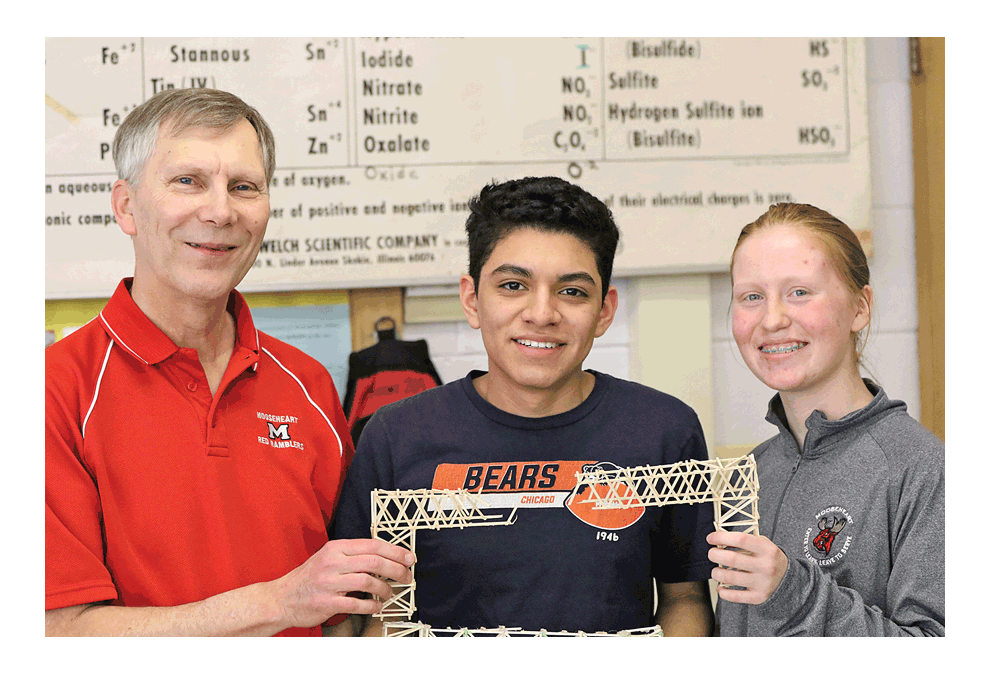 From left: Mooseheart physics teacher Curt Schlinkmann and seniors Anthony Gomez and Amanda Jones. Schlinkmann, who originated Mooseheart’s bridge-breaking contest in 1987, will retire at the end of this school year. Mooseheart Communications photo