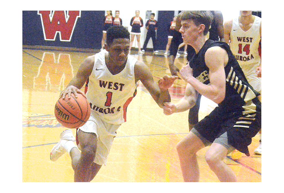 West Aurora High School point guard Traevon Brown, 1, drives against a Streamwood opponent Friday, Jan. 4 in an Upstate Eight Conference game in Aurora. Brown, a senior, scored 18 points in the 76-58 victory. Saturday evening, West Aurora rallied to defeat visiting DeKalb, 61-59, in a non-conference game. Al Benson/The Voice