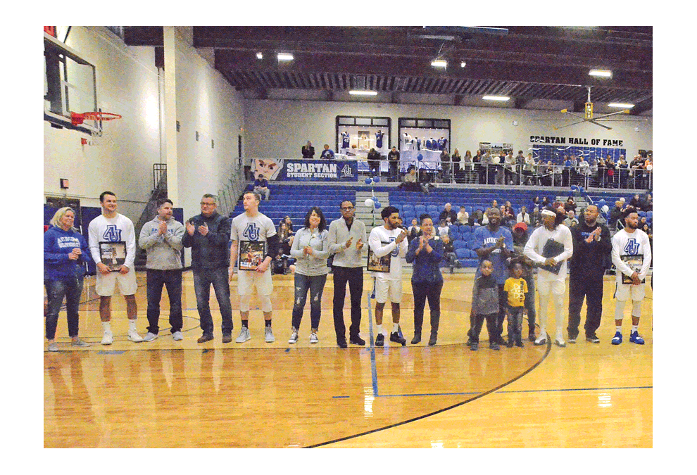 Ty Carlson, Aurora University basketball senior, Elburn, Kaneland High School, second from left, among five Aurora University seniors receive honors prior to the last regular season home game at Lancaster Court Saturday, Feb. 9. Other seniors saluted include Marquis Howard, Aurora, West Aurora High School; Max Vickers, Streator; Brandon James, Rockford; and Demetrius Pointer, Chicago. Al Benson/The Voice