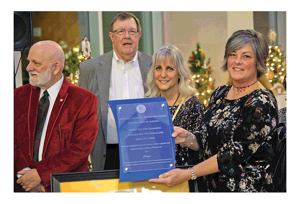 Kiwanis Club of Aurora members receive the Aurora Public Library Foundation Lifelong Learning Inspiration Award at a recent event at Santori Public Library of Aurora. From left, Kiwanis members Larry Frieders, Jack Hienton, Amy Roth, and Kim Groom.