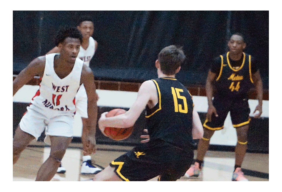 Metea Valley High School’s Ethan Helwig, 15, finds initial defense from West Aurora junior Kenin Balfour at East Aurora Saturday. West Aurora won, 85-66. See page 10. Carter Crane/The Voice