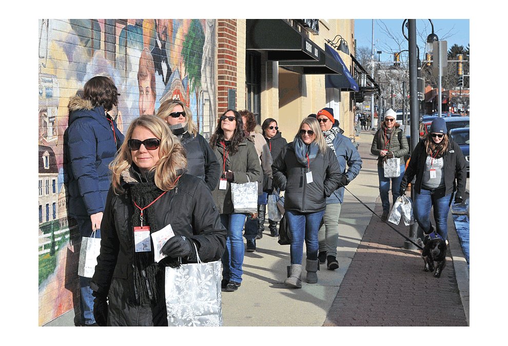 The fourth annual downtown Naperville Chocolate Walk Sunday brings together a nice group to help raise funds for 360 Youth Services. Jason Crane/The Voice