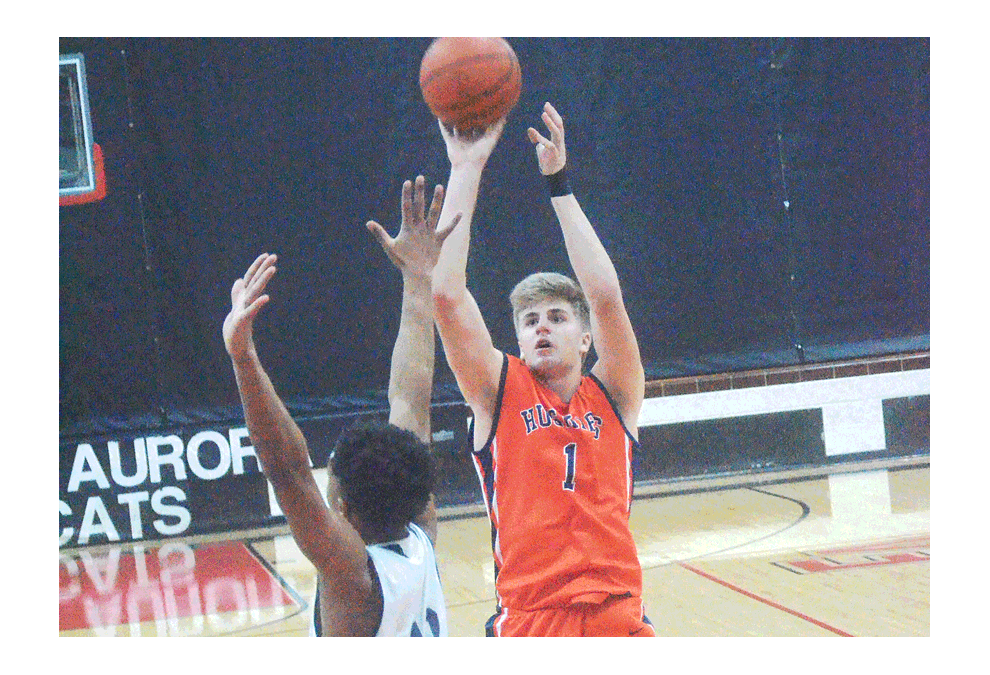 Naperville North High School guard Tom Welch, 1, shoots over a Chicago Lincoln Park defender at the ninth annual Ernie Kivisto Hoopfest Saturday. Lincoln Park won, 42-39, at East Aurora High School. Al Benson/The Voice