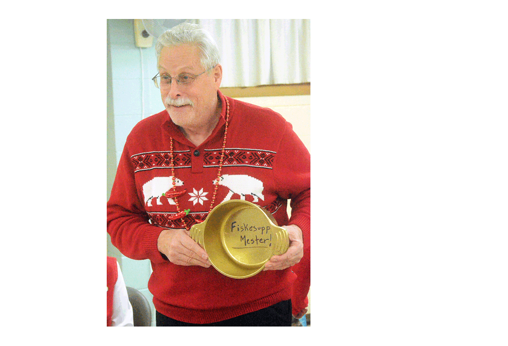 Steve Tanda of St. Charles, right, displays his gold-colored soup pot as champion of a fish-soup cook-off by Sons of Norway Polar Star Lodge 5-472 Sunday, Feb. 3. The Norwegian-American social group held its first fiskesuppe, fish-soup contest, which attracted seven entries at St. Olaf Lutheran Church in Montgomery. Auroran Al Bergh's fish stew won runner-up honors. The top chefs were voted in blind taste tests by lodge members. Contestants’ recipes will be published in a cookbook by the Norsk Museum in Norway, Ill., in the Fall. The cook-off continues a monthly cooking club sponsored by the lodge. Members prepare recipes in advance, or in the church kitchen for serving at a potluck luncheon. Al Benson/The Voice