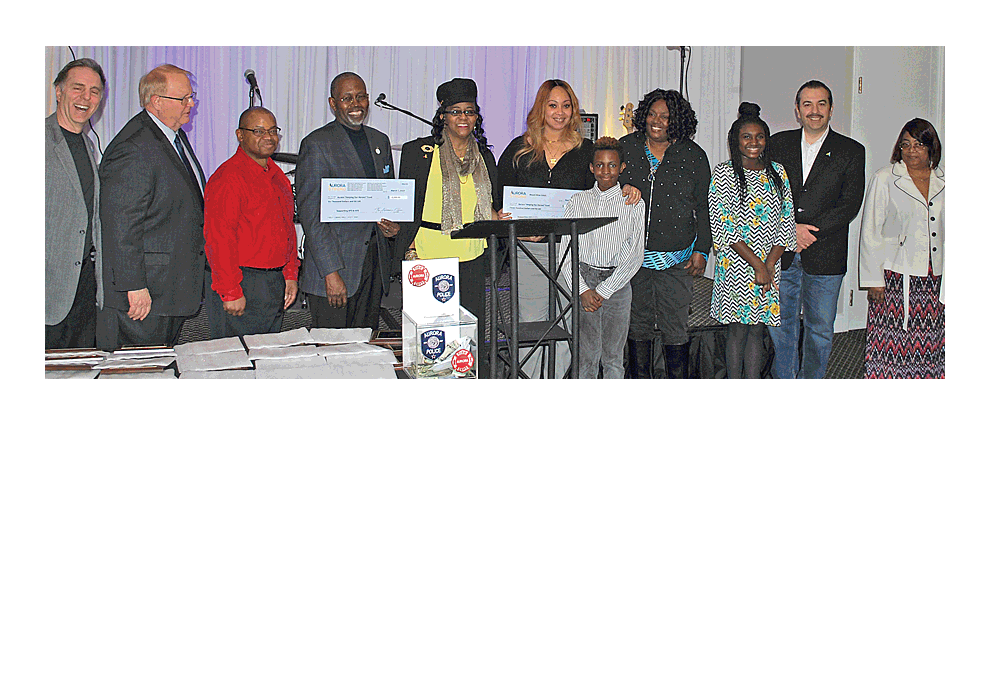Alderman of Aurora’s 7th Ward, Scheketa Hart-Burns, fifth from left, was host to a fundraiser Thursday, March 7, at Belle Salle Events Center in Aurora. Many organizations were honored for raising thousands of dollars for additional safety gear for police and fire personnel. Stories of bravery and appreciation were shared by current and retired first responders. Commander Keith Cross of the Aurora Police Department indroduced Adam Miller, one of the five Aurora police officers who was injured in the shooting at the Henry Pratt Company warehouse Friday, Feb. 15. A video can be seen at facebook.com/thevoice.us. Jason Crane/The Voice