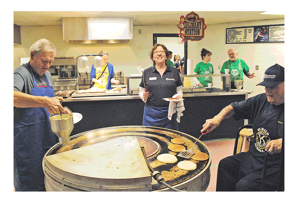 Pancakes: Love and history: The 69th Annual Kiwanis Club of Aurora Pancake Breakfast, Saturday, at Aurora Central Catholic High School, finds Kiwanis Club of Aurora members working together to make thousands of pancakes on two rotating grills that were designed and built by Kiwanis member Al Sinden, vice president of Engineering at Stephens-Adamson in Aurora. The first grill was built in 1959 for the total cost of $512.34. It started in 1960 and served 3,202. Grill No. 2 was made a couple of years later. In 2015, Grill No. 1 was named for long-time member, Hal Beebee, who passed away in 2015. A video can be seen at facebook.com/thevoice.us. Jason Crane/The Voice