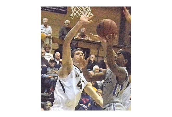 Aurora University guard Demetrius Pointer, right, shoots against an Augustana College defender Friday at Augustana in Rock Island in the first round of the NCAA Division III national tournament. Augustana won, 93-67. Al Benson/The Voice