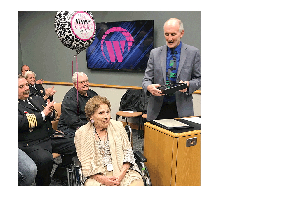 Mayor Ron Gunter, right, and the Westmont Village Board, provides an honor to longtime Westmont resident, Anne Szymski, with the key to the Village and a proclamation to celebrate her 100th birthday. “We like to celebrate people who have been influential in the community, and I can’t think of anyone more deserving than Anne Szymski and the entire Szymski family,” Gunter said. Anne and her husband, Steve, who passed away in 2002, moved to Westmont in 1945 and started many businesses in Westmont, including Westmont Dry Goods Center, Stephen’s Department Store, O.K. Hardware Builders, Family Shoe Store, and Stephen’s Annex Domestics. Submitted photo