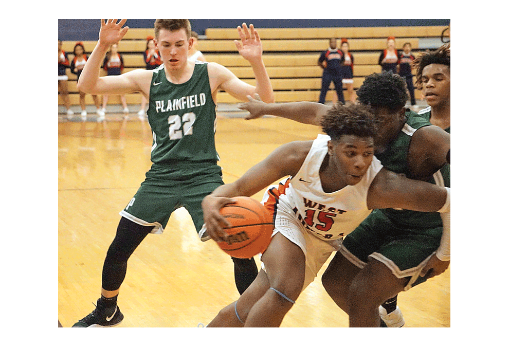 West Aurora High School senior Marquise Walker works his way out of a jam in the corner filled with Plainfield Central defenders in the Oswego Regional Class 4A championship game Friday. Plainfield Central defenders include Andres Gomez, 22, Cordell Wallace, and Javari Johnson. West Aurora won, 66-65, to advance to this week’s East Aurora Sectional tournament. Carter Crane/The Voice