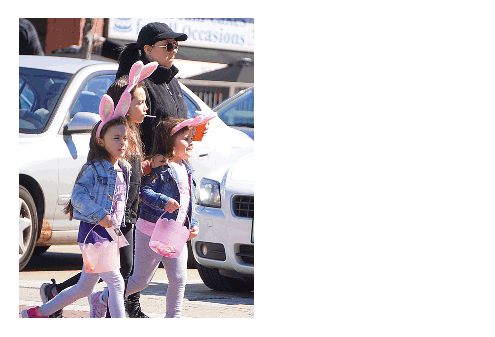 Downtown Easter Egg Hunt participants cross the street in Batavia Saturday. Carter Crane/The Voice
