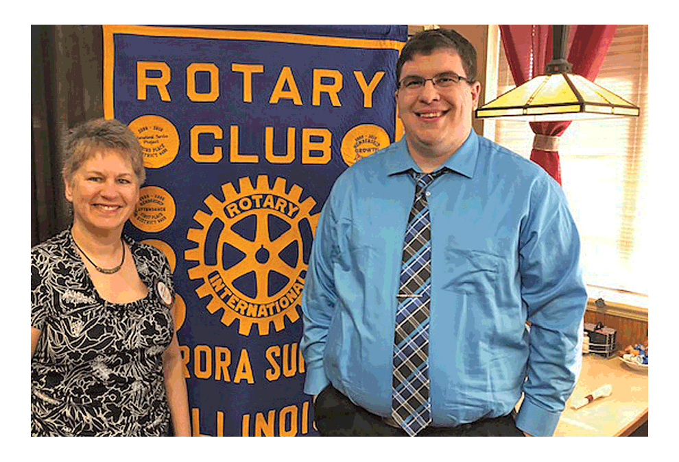 Linda Callaghan, left, president of the Aurora Sunrise Rotary Club, welcomes Brian Failing, executive director of the Aurora Regional Fire Museum, who gave a report on the state of the museum to the Rotary Club at Mother’s Pancake House in Aurora. Failing has been executive director for three years. Visits to the museum have increased from 3,000 annually to 11,500. Tom Clark photo