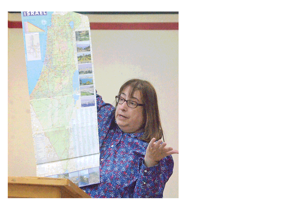 Marilyn Katz of Aurora shows a map of Israel during a presentation for the Aurora Noon Lions Club Monday at Luigi's Pizza in Aurora. Katz, a member of Aurora's Temple B'nai Israel, returned from a trip to Israel recently and had lived in Israel for eight years while she earned a college degree. Al Benson/The Voice