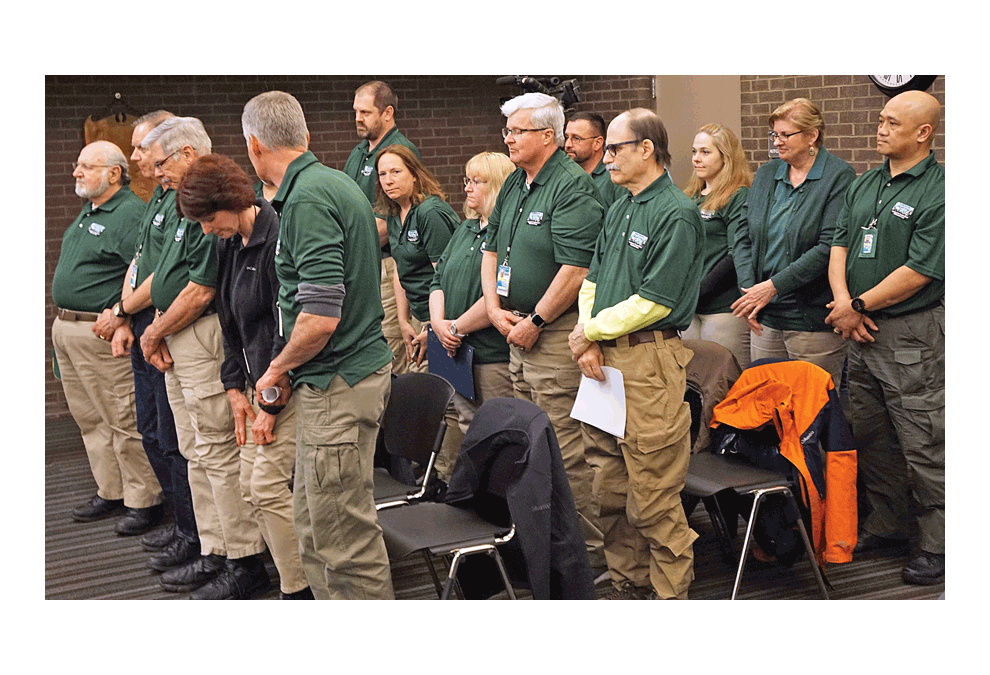 The North Aurora community emergency response team (CERT) receives applause and appreciation at the Village Board meeting Monday after Village president Dale Berman read a proclamation declaring April Volunteer Appreciation Month in North Aurora. Chief David Fisher said in 2018 2,067 hours were volunteered, almost double from the 1,131 in 2017. He estimates the Village saved more than $51,000 in 2018 because the volunteers assist paid staff members during disasters and other emergencies, planned events such as North Aurora Days and parades. Volunteers may assist with directing traffic, perimeter/access control, triage/first aid, light search and rescue, shelter set up, and operation. Jason Crane/The Voice