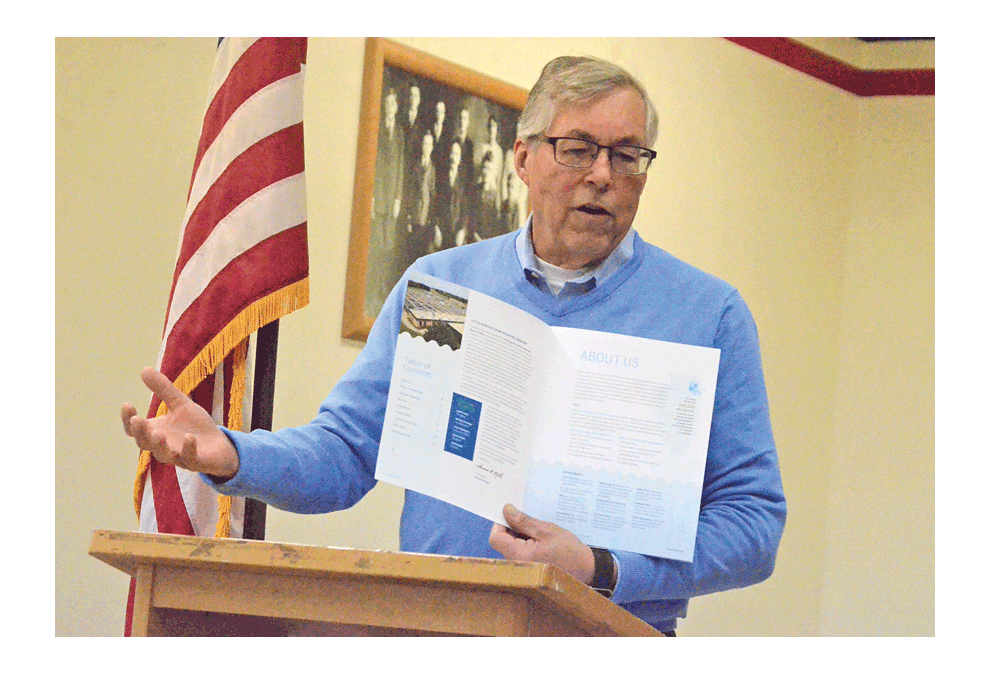 Tom Muth, Fox Metro Water Reclamation District manager, shows the District's 2018 Popular Annual Financial Report Monday to Aurora Noon Lions Club members. Muth, an Aurora Noon Lion member, said the report is intended to be a brief, but meaningful summary of the services that Oswego-based Fox Metro provides for 300,000 residents from Batavia to Yorkville. Al Benson/The Voice