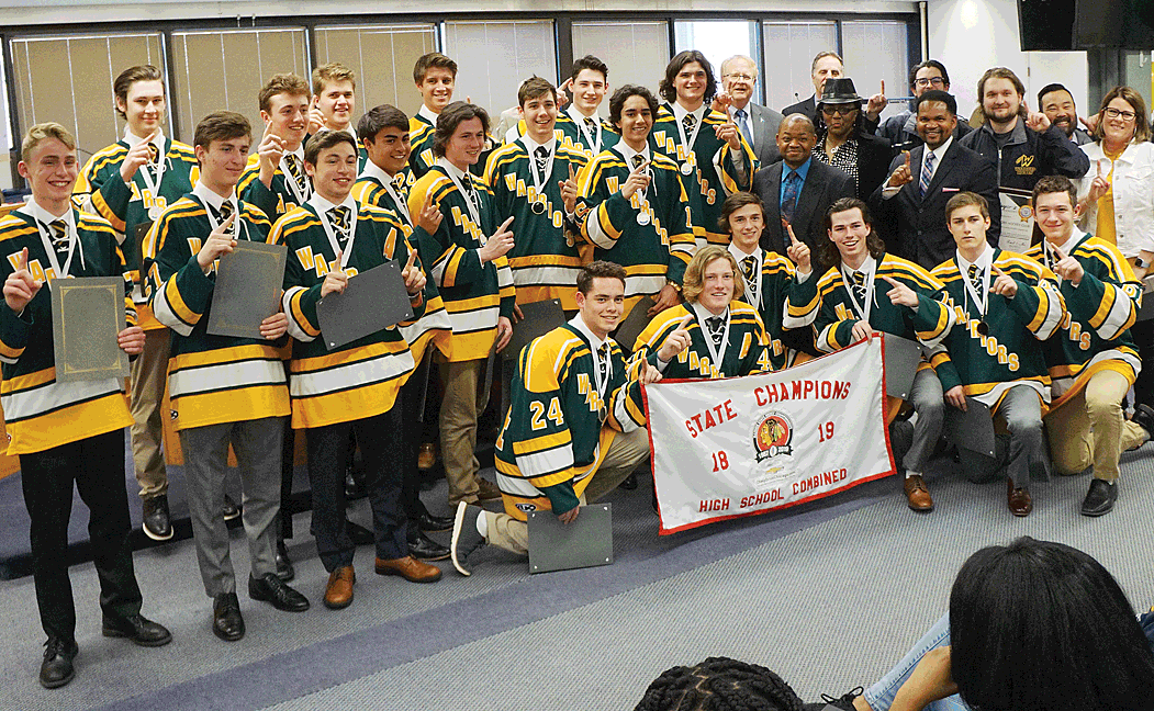 State champion: Waubonsie Valley High School/Metea Valley High School ice hockey team of Aurora receives a salute from the Aurora City Council Tuesday evening at Aurora City Hall for recently capturing the Illinois State high school hockey championship in the Combined Varsity tournament. Both schools are in District 204. There are five levels. Wheaton West Black captured the Junior Varsity Combined championship. Jason Crane/The Voice