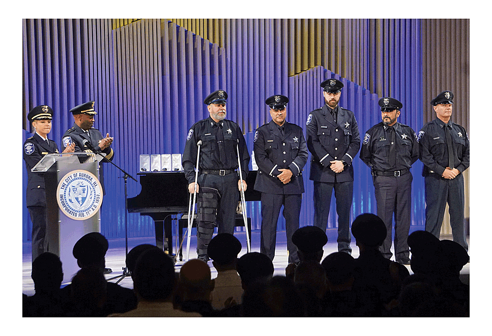 Special salutes offer honors to Aurora Police Department members involved in stopping the shooting to save lives at the Henry Pratt warehouse in Aurora February 15