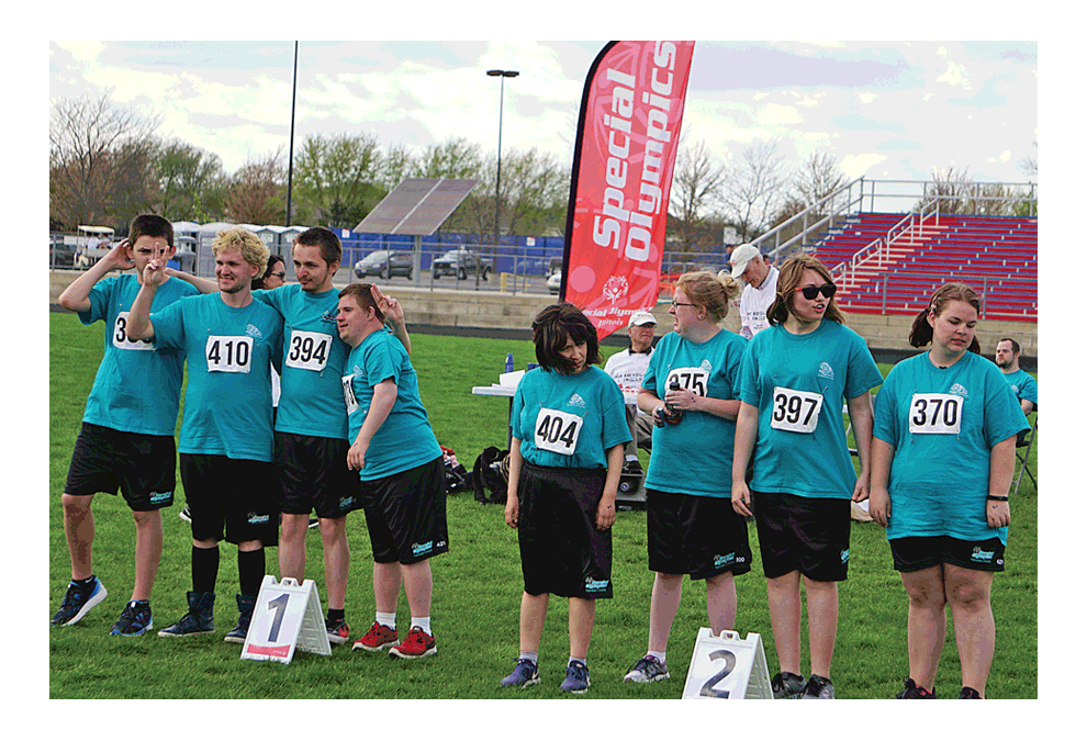 Two Kendall County Comets' Special Olympics teams pose during first and second place ceremonies at Marmion Academy