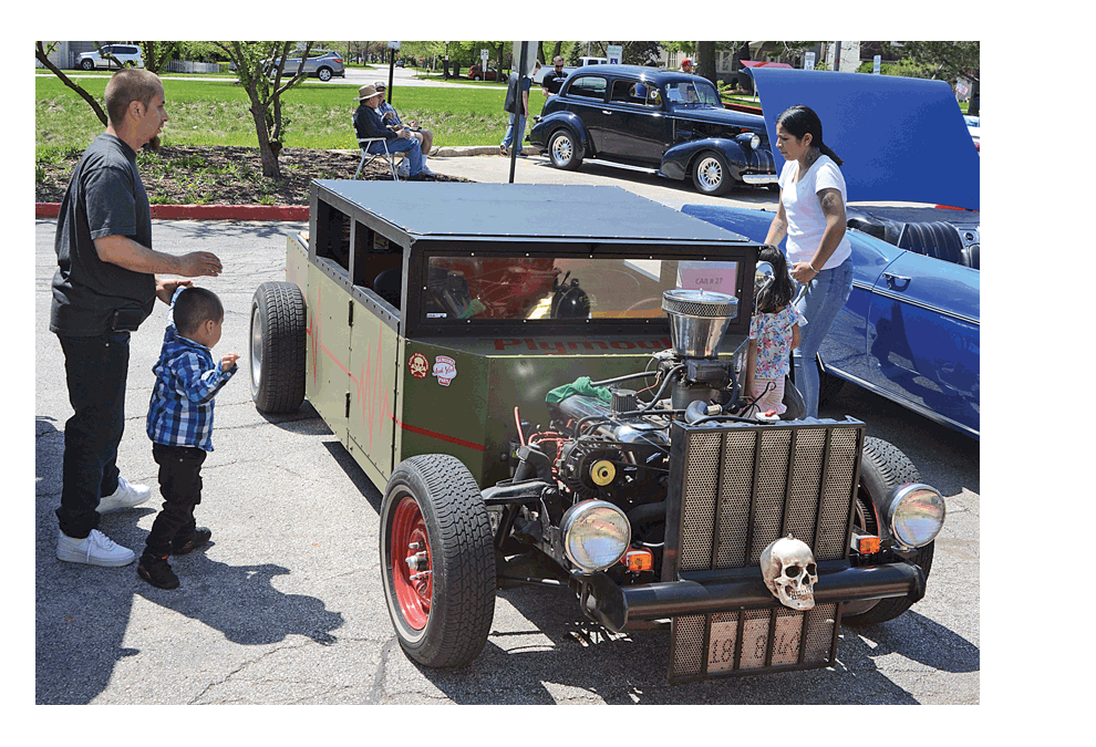 Frankenstein handmade: Aurora resident Chuck Fuller's "Frankenstein," a handmade car, attracts visitors to the third annual benefit car show at West Aurora High School Sunday. Al Benson/The Voice