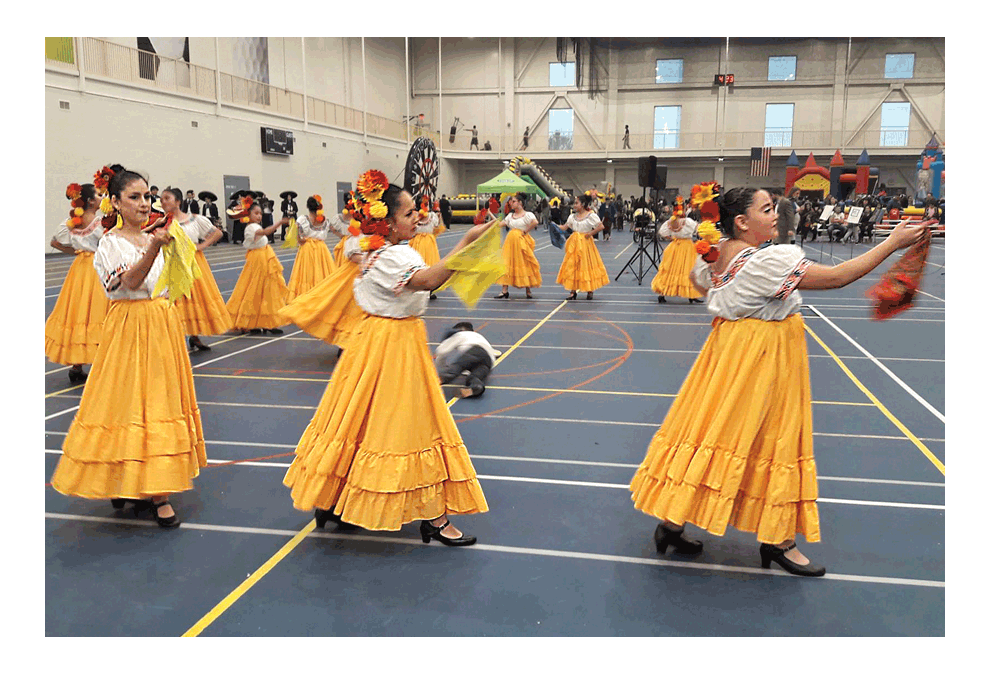 Dancers participate and entertain at the El Dia de Los Ninos last week at the Vaughan Center in Aurora. John Ross/ The Voice
