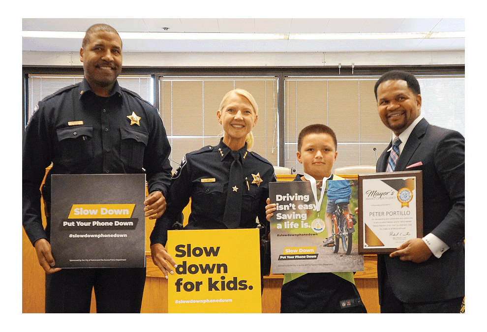 Aurora campaign of Slow Down Put Your Phone Down and Slow down for kids shared the spotlight with Peter Portillo a State patroller of the year award recipient