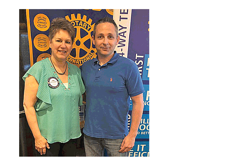 Linda Callaghan, president of the Aurora Sunrise Rotary Club offers thanks to Ben Pohl, for an eye-opening presentation on distracted driving
