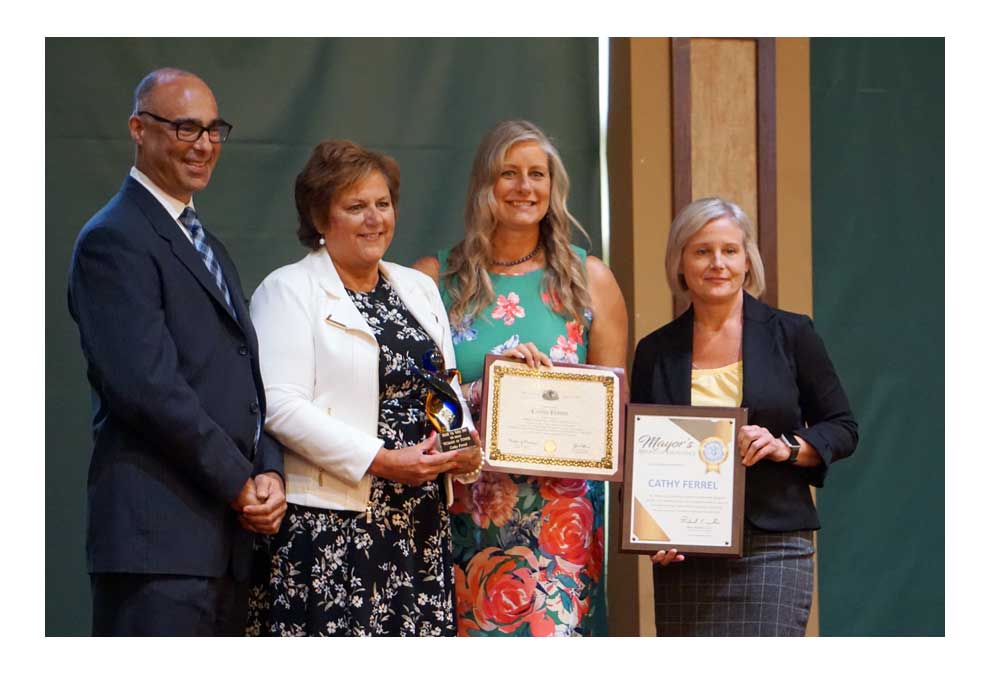 Cathy Ferrel, second from left, is the Share Fox Valley 2019 Woman of Power Award recipient.