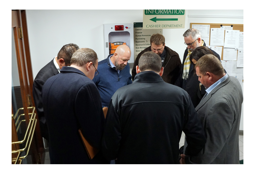 Members of the Fox Valley Developers give a prayer of thanks on the first floor of Aurora City Hall after the Aurora City Council approves a $9 Million Redevelopment Agreement For The Adaptive Reuse of The Former Copley Hospital Campus November 12, 2019