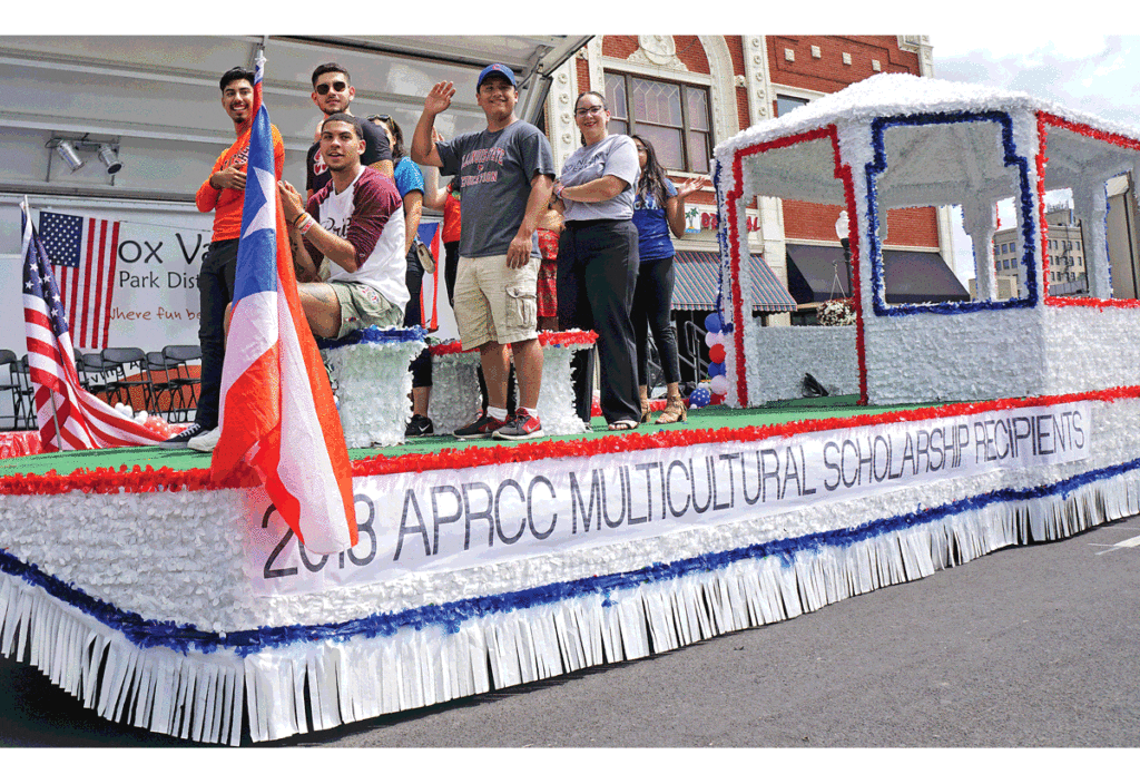 APRCC multicultural scholarship recipients receive a ride on a float. 