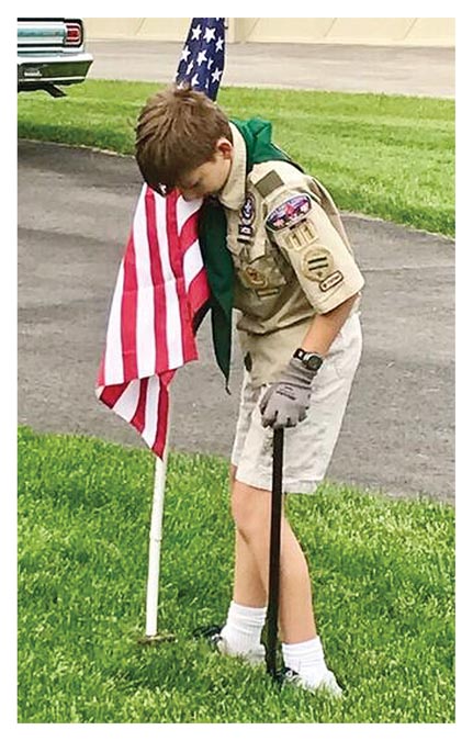 Scout posts flags in Aurora – The Voice